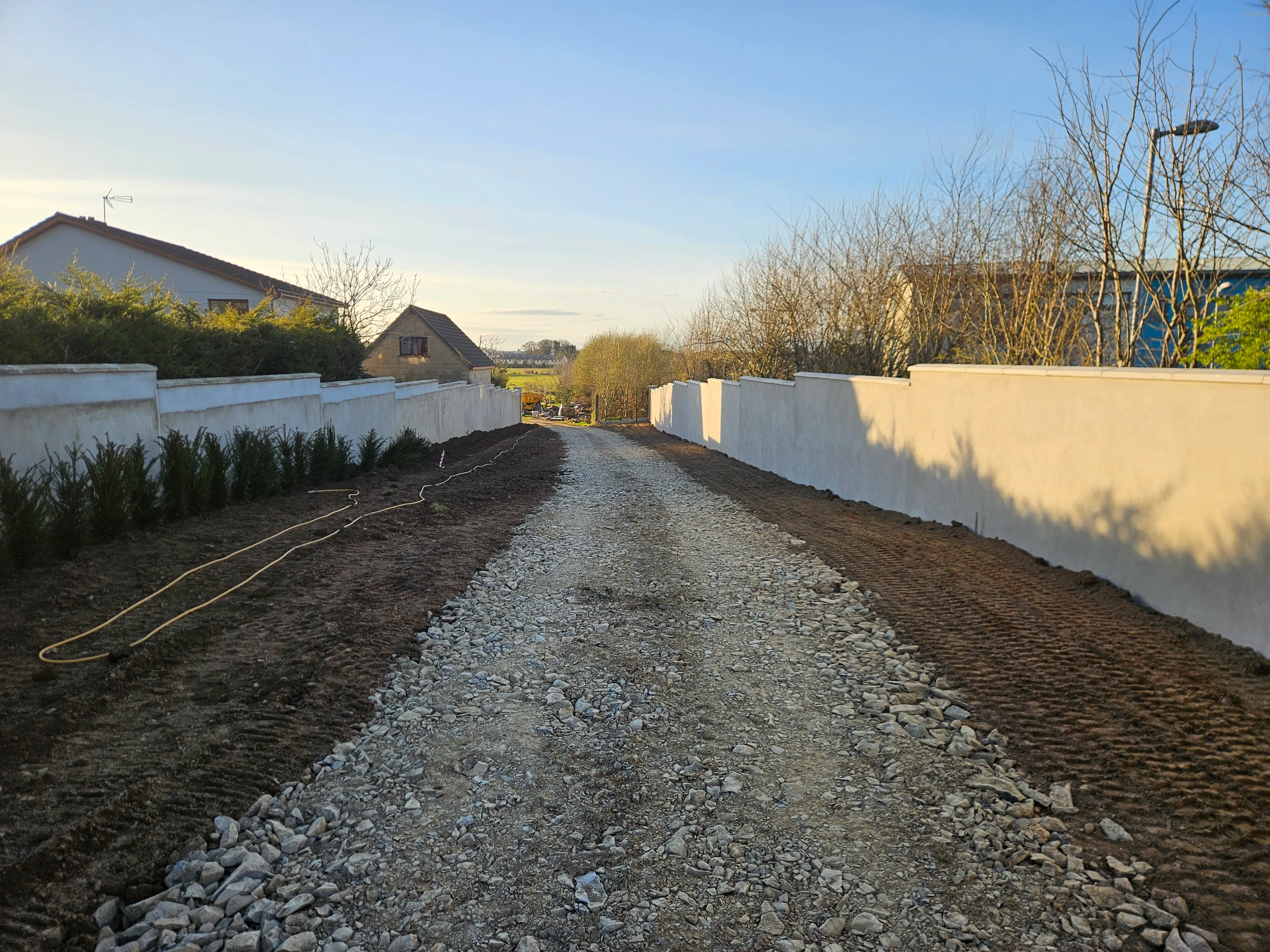 A garden project showing lawn restoration alongside patio work