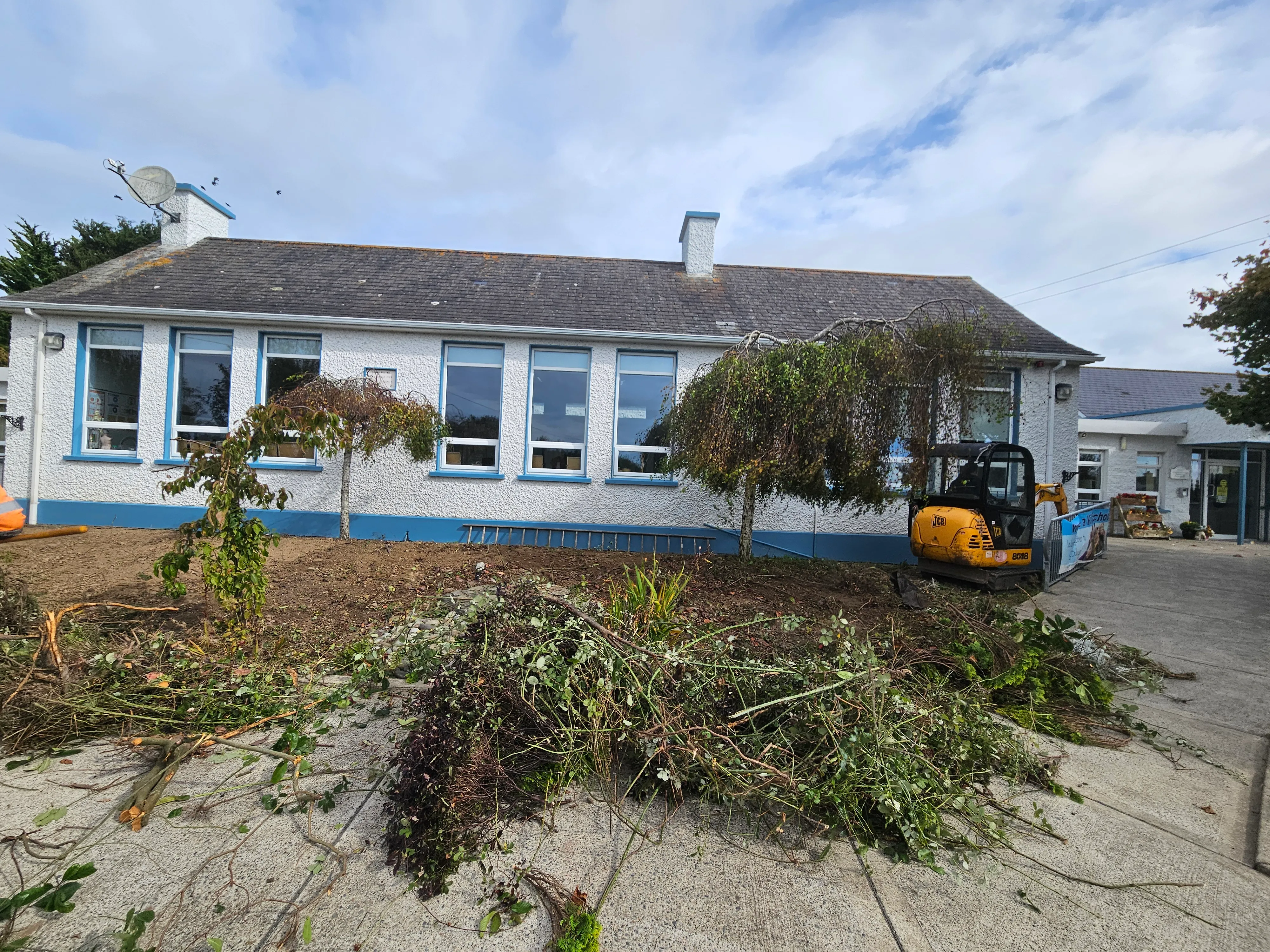 Clearance in progress — working carefully around the building