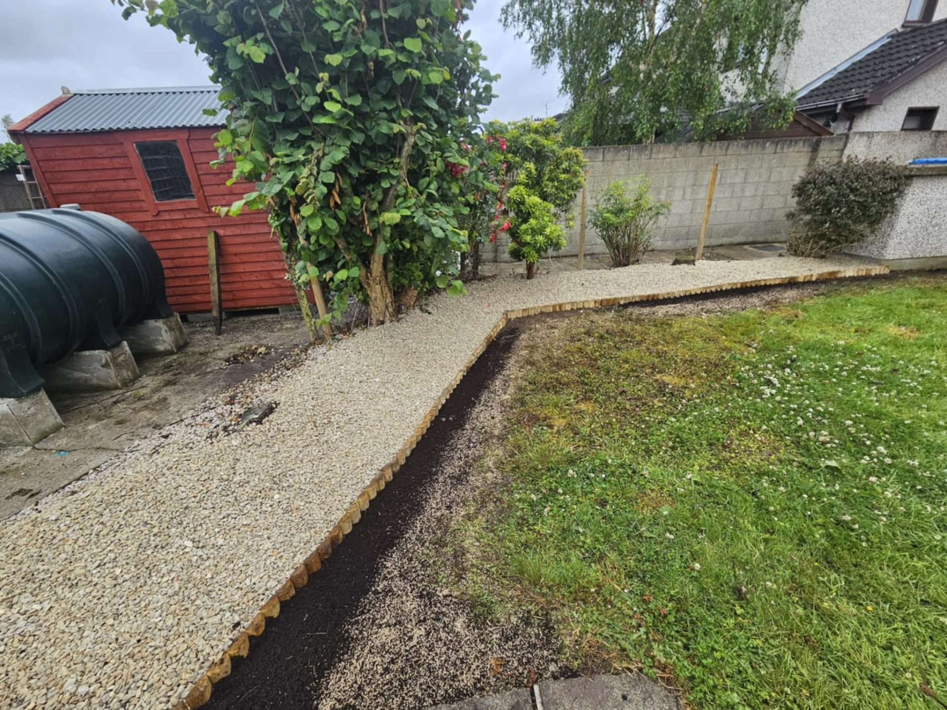 Gravel Path & Greenery: A Backyard Reborn